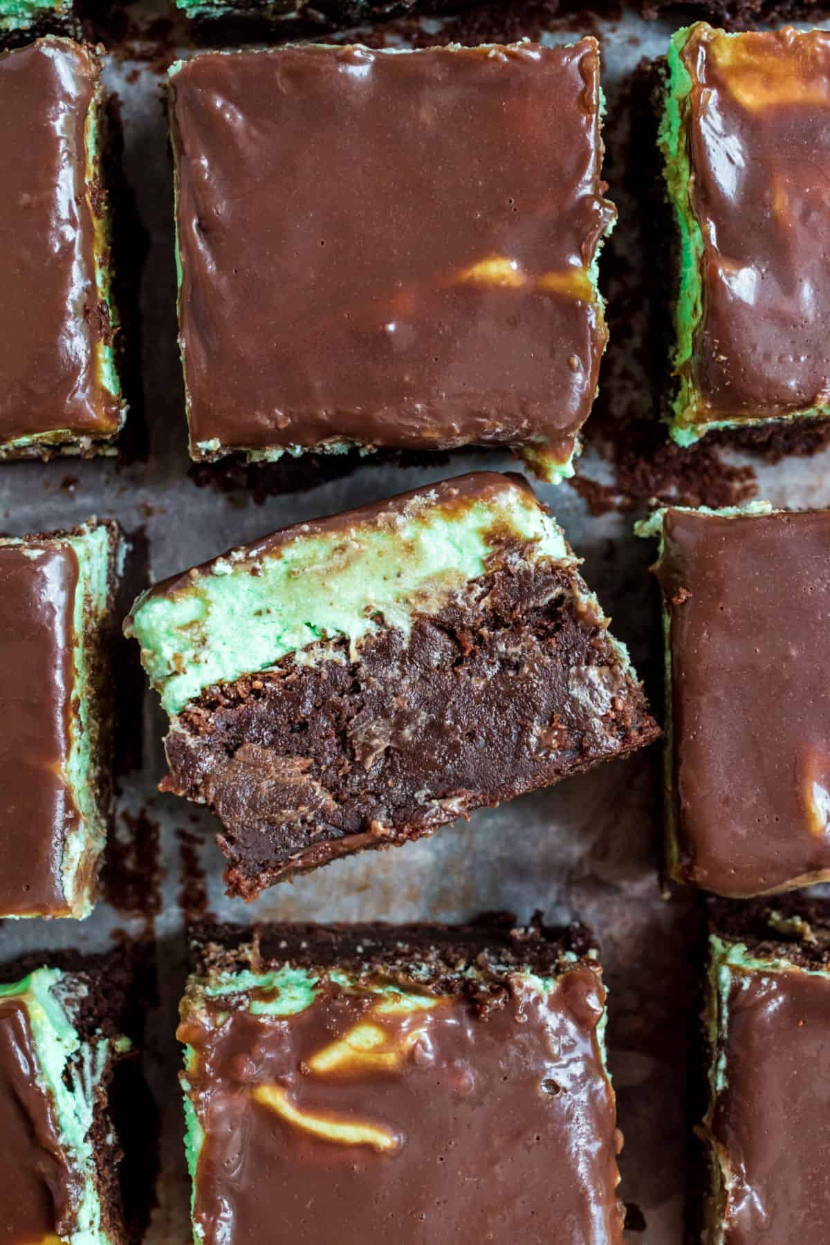 Chocolate brownies with mint filling and chocolate ganache on top.