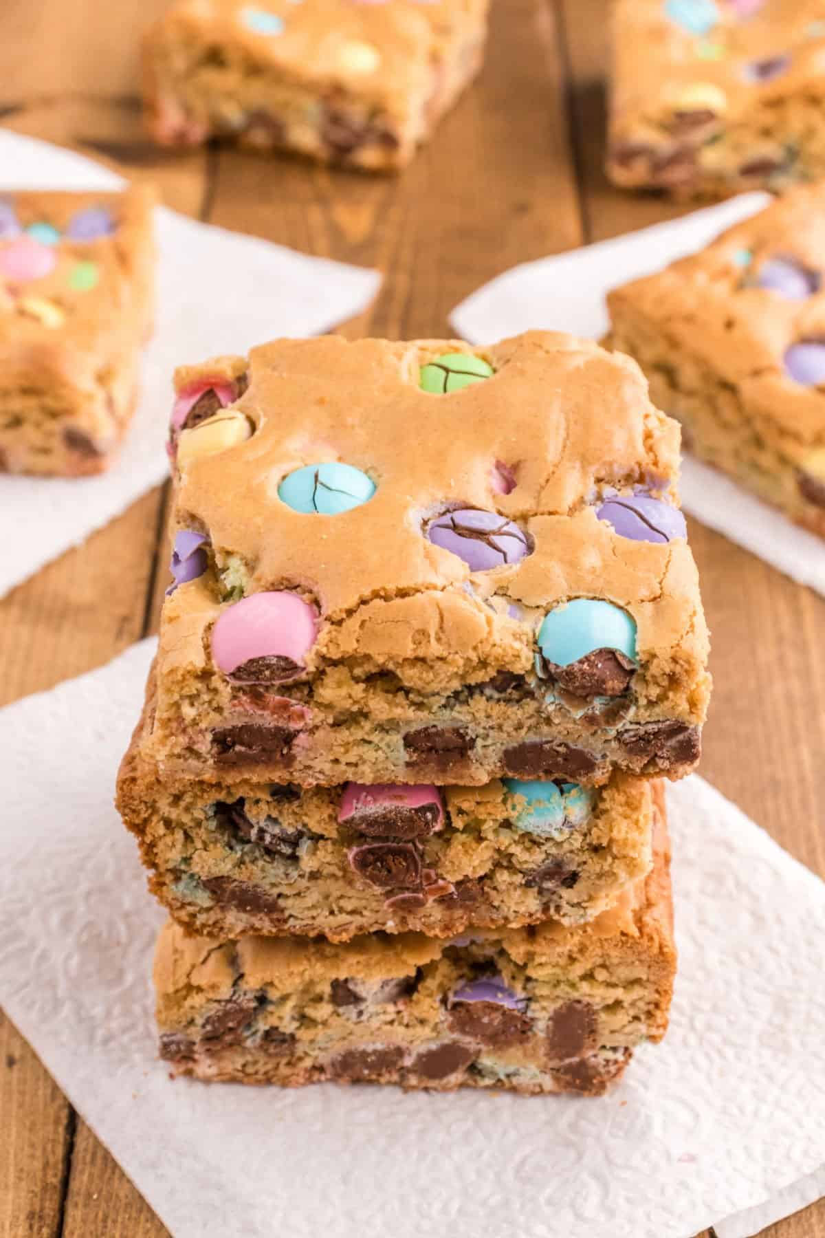 Stack of three blondies with pastel candy.