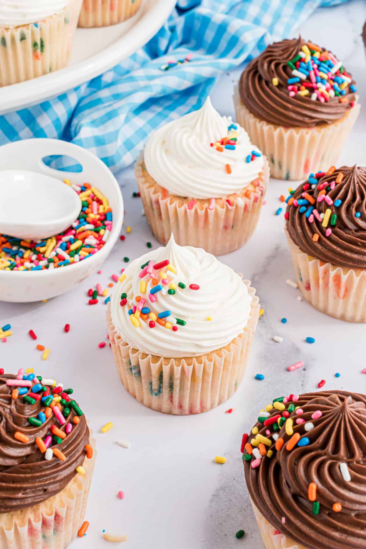 Funfetti cupcakes with chocolate and vanilla frosting and extra sprinkles.