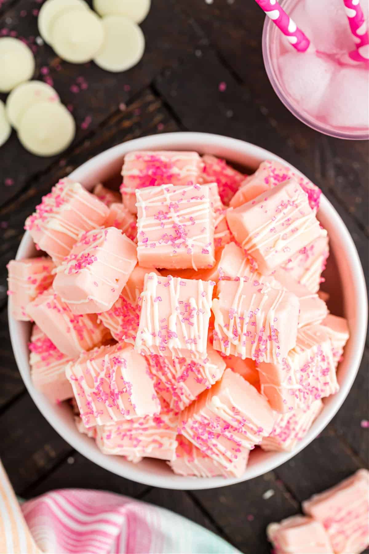 Pink lemonade fudge in a white bowl with pink sparkles.