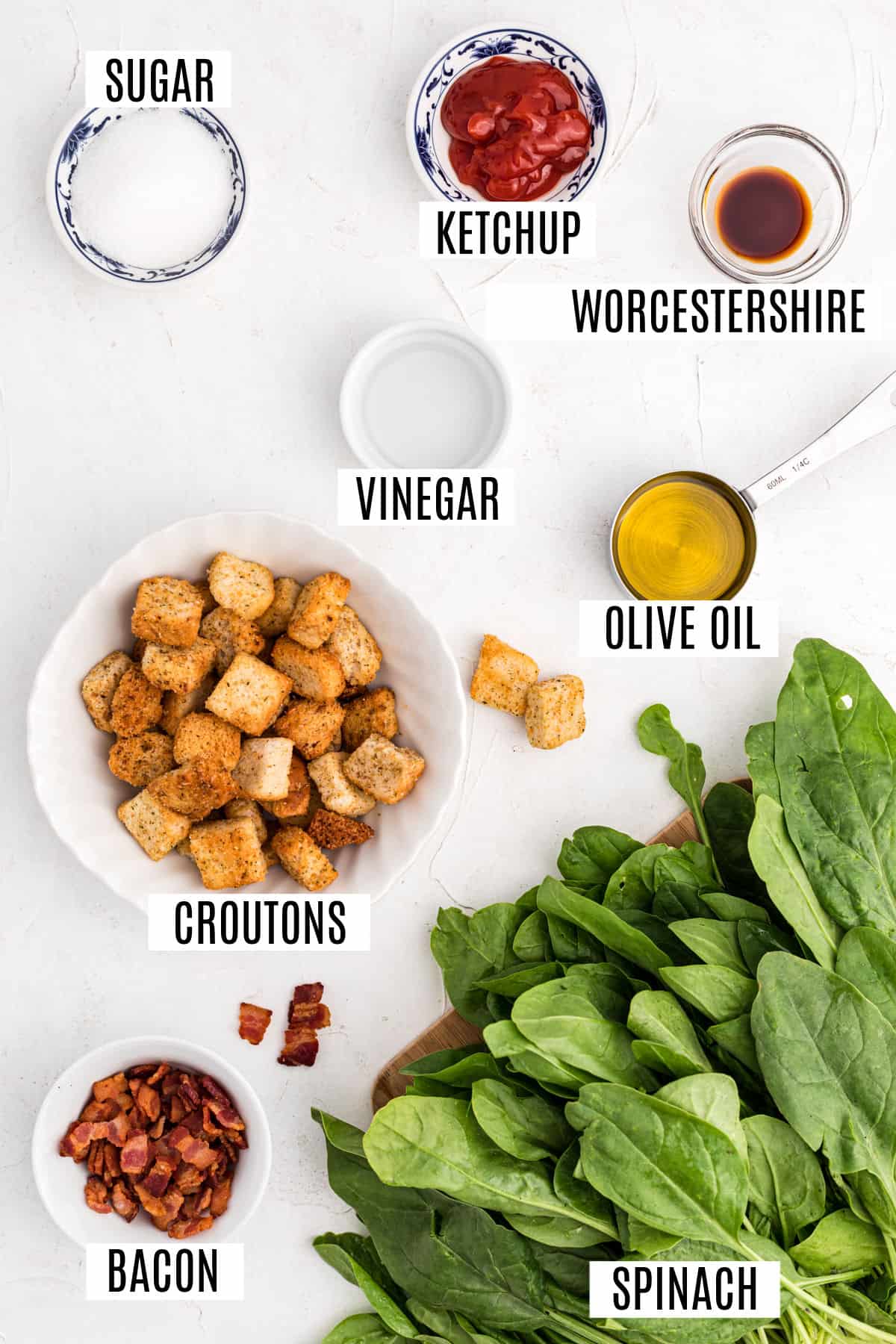 Ingredients needed for spinach salad with bacon.