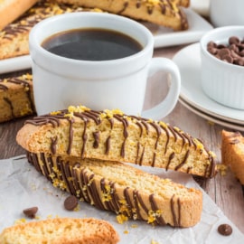 Chocolate Orange Biscotti - A delicious breakfast treat packed with sweet orange flavor and drizzled with chocolate! Put on a pot of coffee and make some of the best biscotti you've ever tasted. 