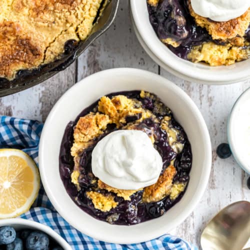 Lemon Blueberry Dump Cake with Almond Whipped Cream is an easy, no mess recipe made with pantry ingredients!