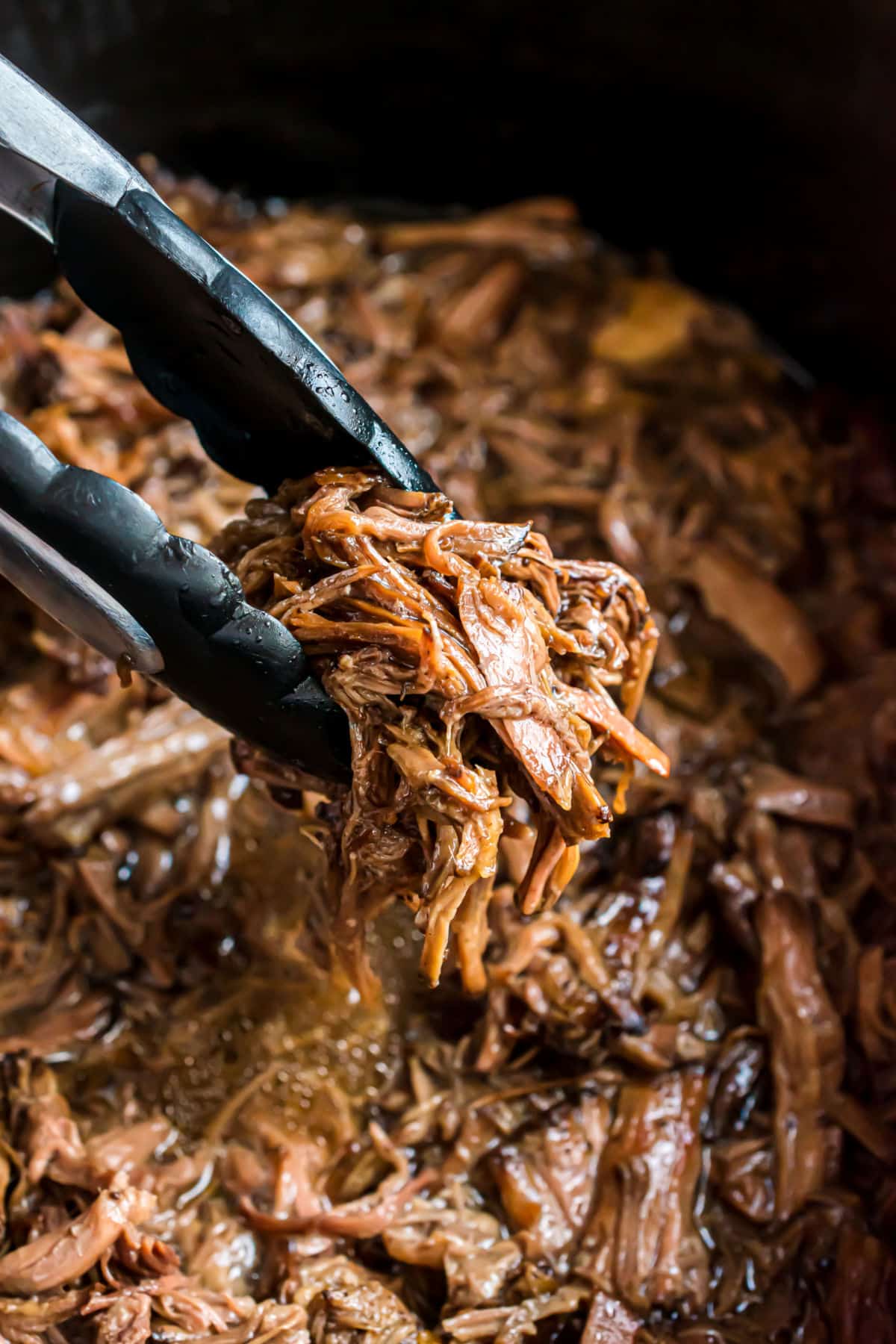 Shredded beef in a balsamic glaze in the crockpot.