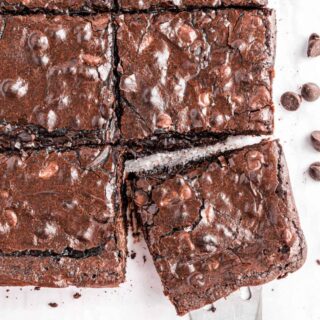 Dark chocolate brownies sliced into large squares.