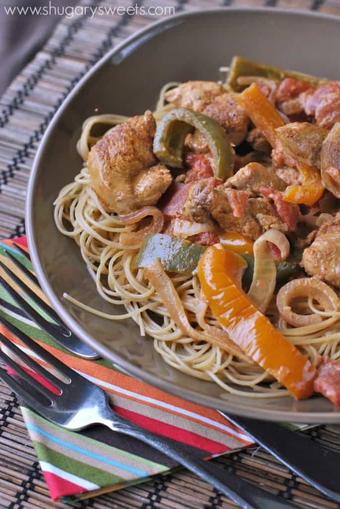 Gray bowl of cajun chicken pasta and peppers.