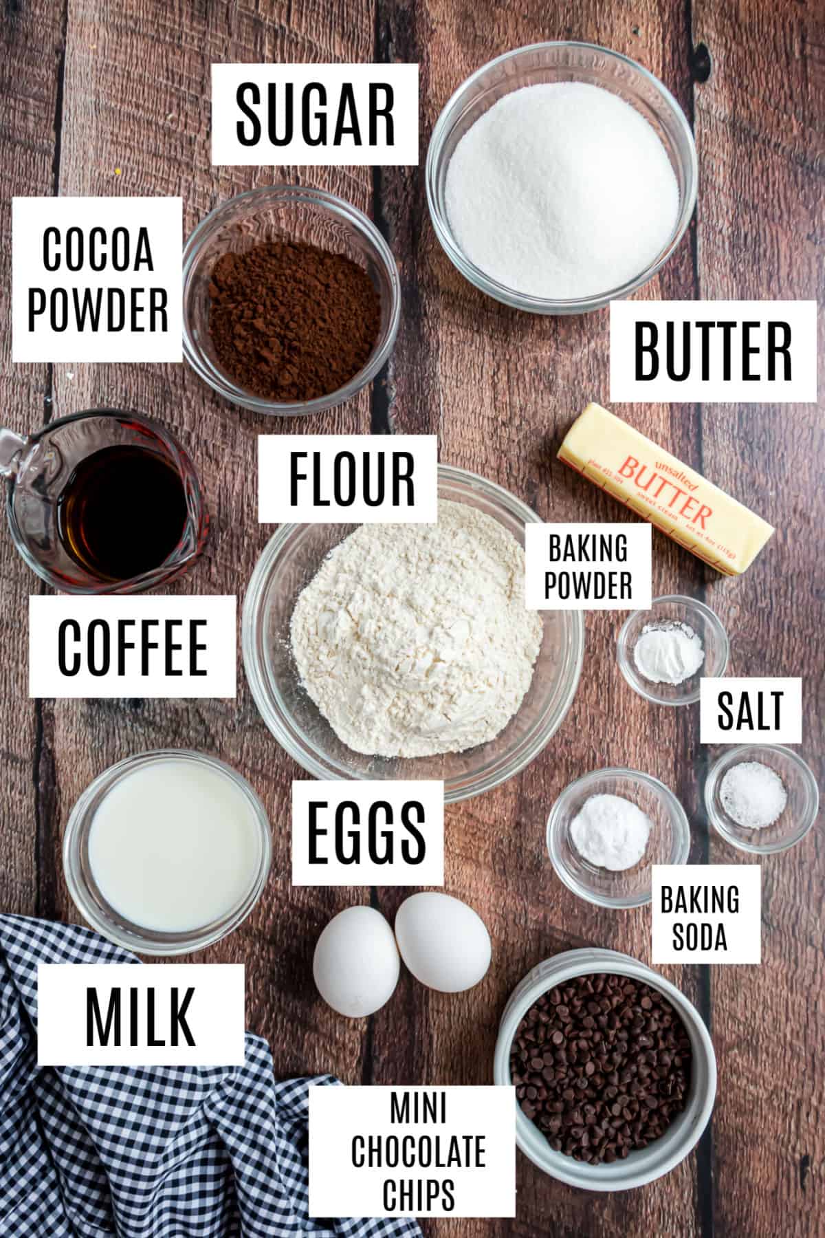 Ingredients needed to make dark chocolate cake from scratch.