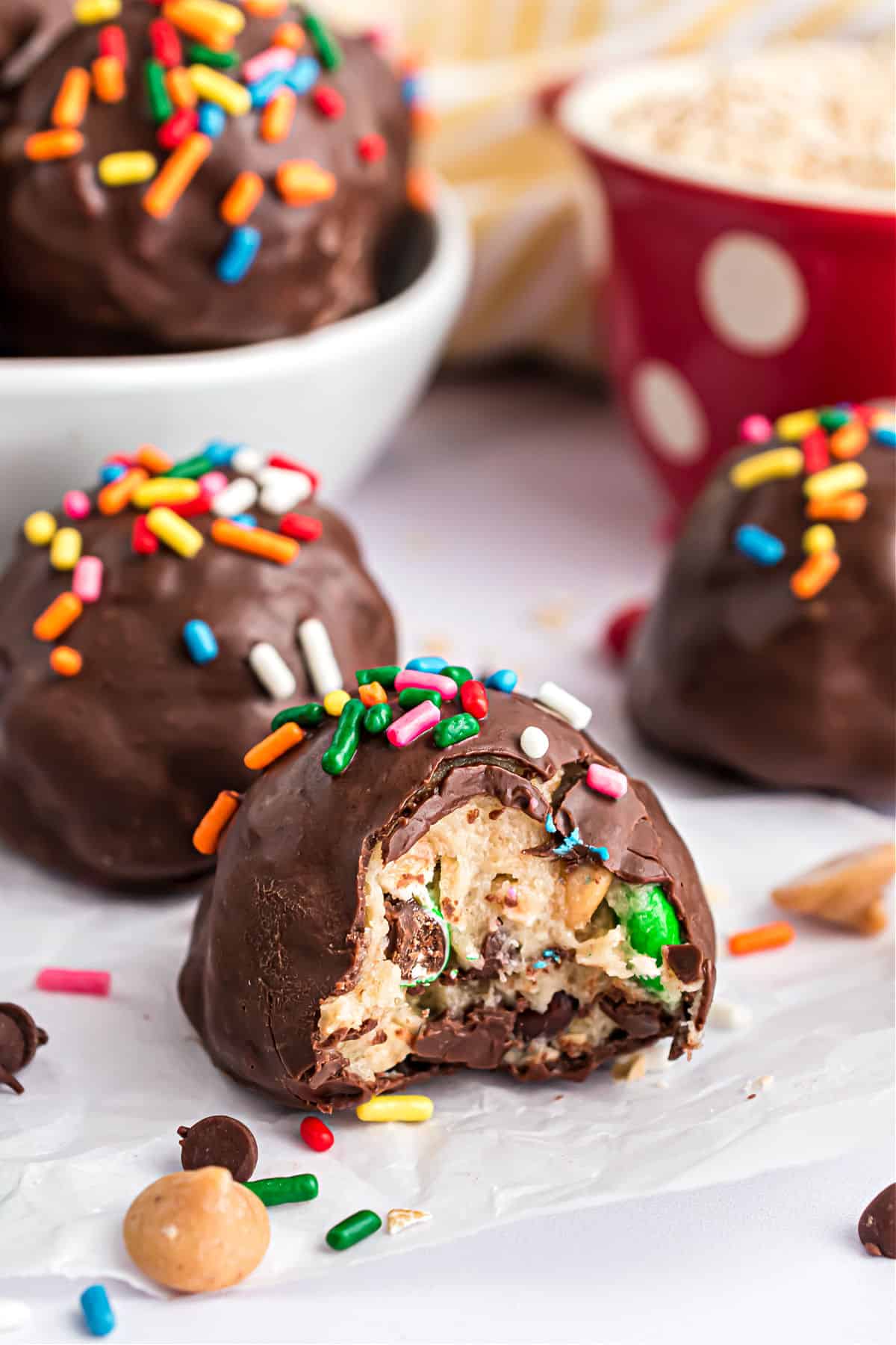 Monster cookie dough in a chocolate truffle with sprinkles.