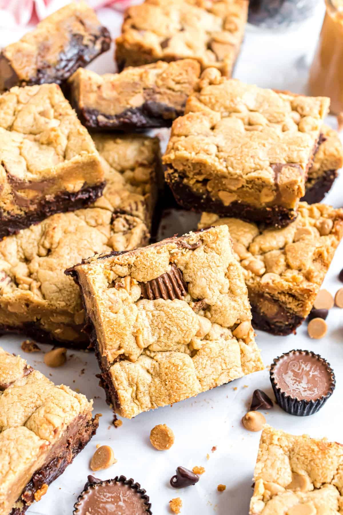Peanut butter brookies cut into squares and stacked.
