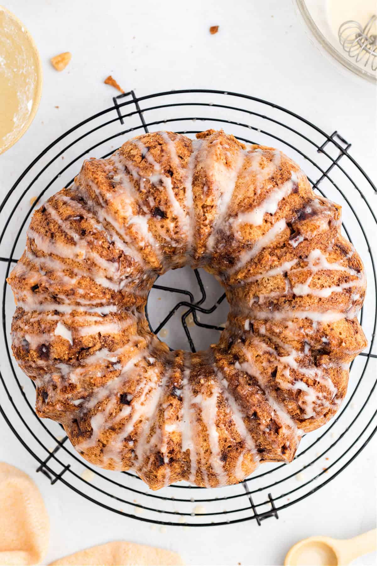 Apple bundt cake on a wire cooling rack.