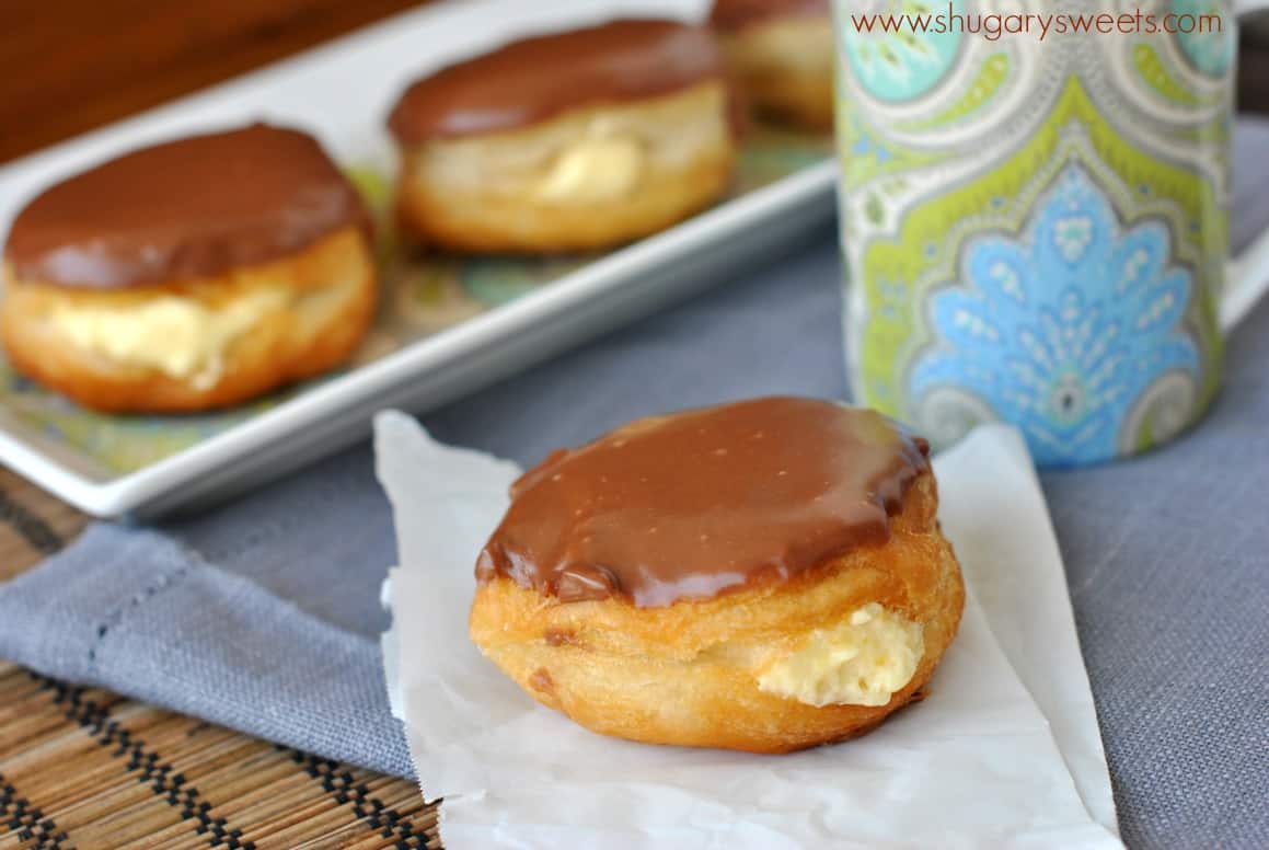 Boston Cream Donuts on a piece of parchment paper.