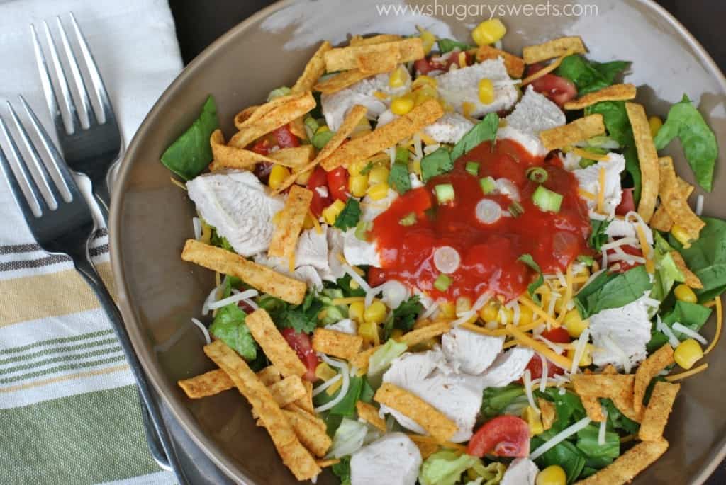 Layered Chicken Taco Salad: a delicious layered salad that's perfect for dinner! Bring to your next potluck or picnic too!