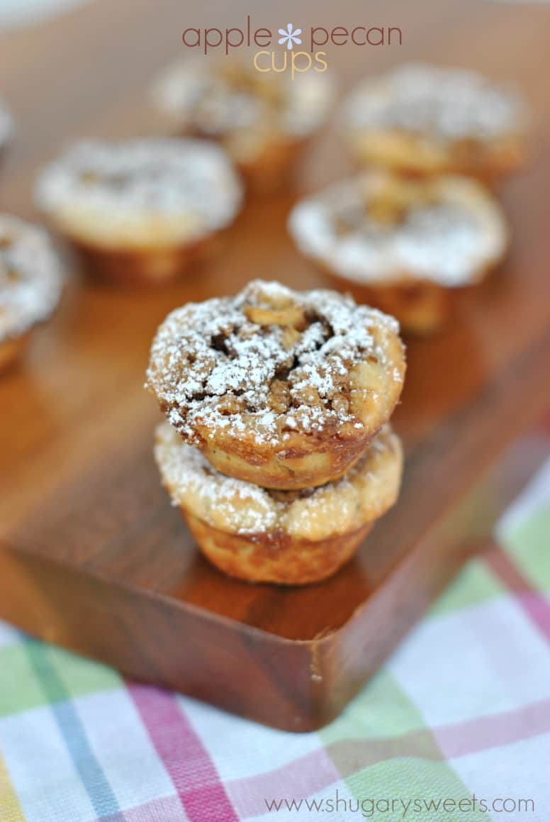 Stack of two apple pecan cookie cups on a wooden cutting board.
