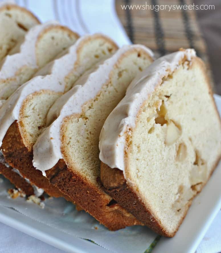 Sliced apple cake with frosting.