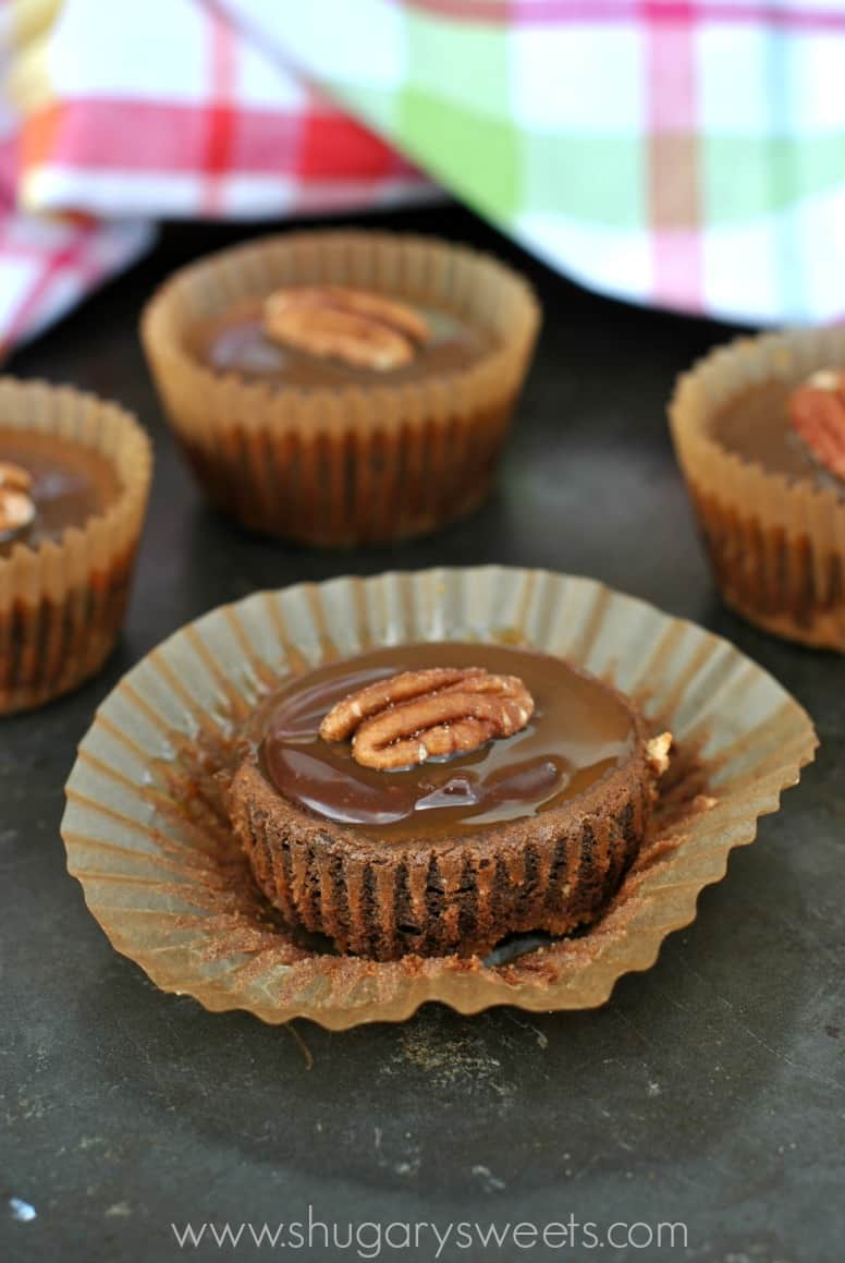 Individual chocolate cheesecake with turtle topping.