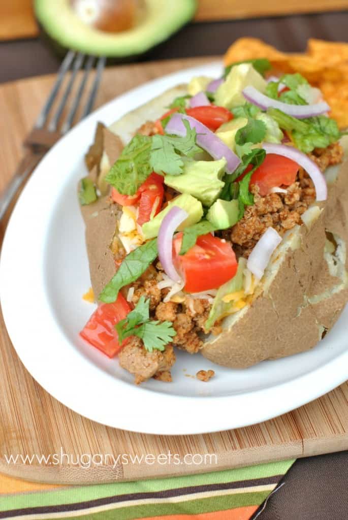 Baked Potatoes topped with taco seasoned ground turkey and all the fixings! Easy delicious dinner idea!
