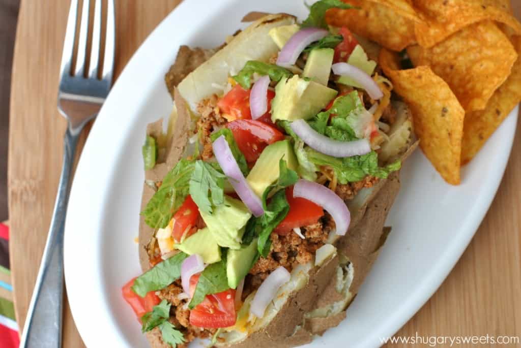 Baked Potatoes topped with taco seasoned ground turkey and all the fixings! Easy delicious dinner idea!