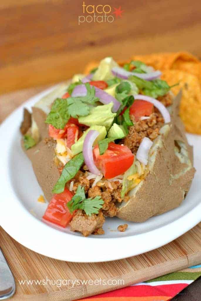 Baked Potatoes topped with taco seasoned ground turkey and all the fixings! Easy delicious dinner idea!