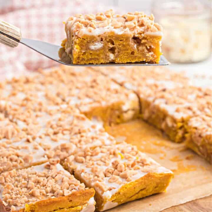 Pumpkin, white chocolate, and toffee unite to turn an old favorite into an instant Fall classic! These Pumpkin Blondies are easier to make than cookies and everything comes together in a single bowl for easy cleanup.