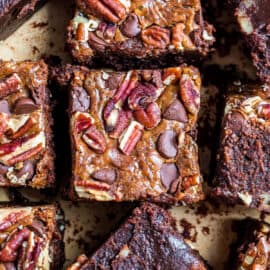 Thick brownies topped with caramel and pecans.