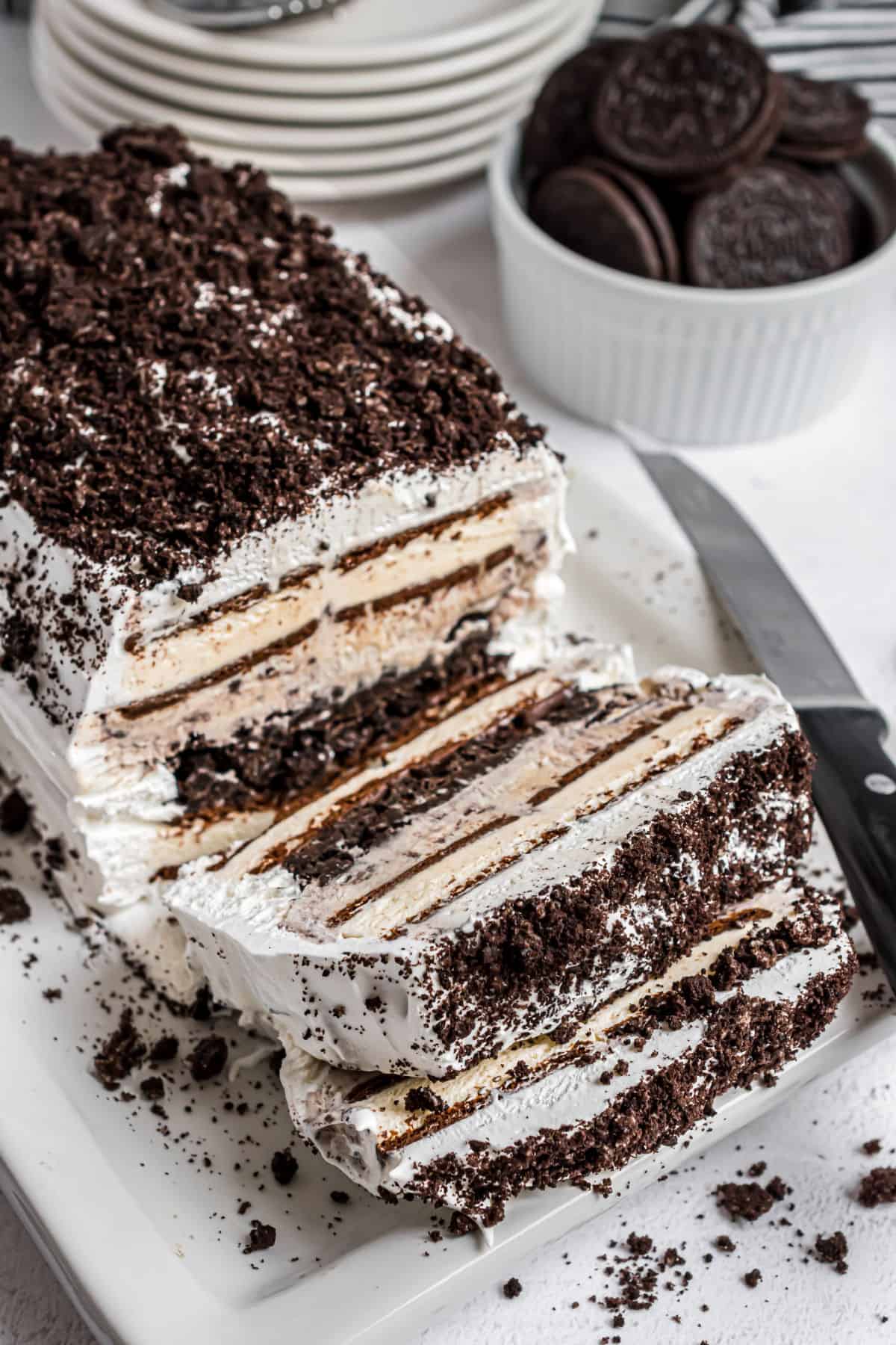 Oreo ice cream cake with slices made so you can see the filling.