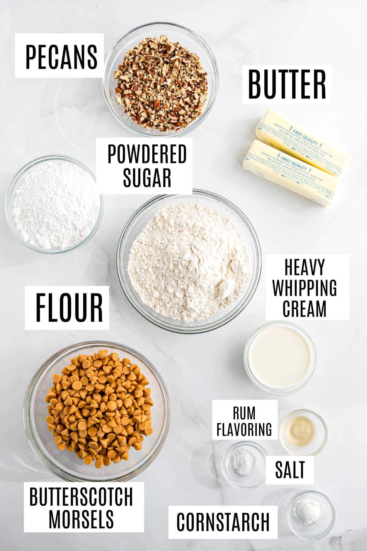 Bowls of pecans, powdered sugar, flour, butterscotch morsels, butter, cream, rum flavoring, salt, and cornstarch—all you need to create irresistible butterscotch cookie cups.