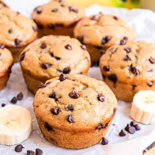 These healthy Banana Chocolate Chip muffins are full of banana flavor, with much less fat than the traditional version. This recipe makes it possible to eat healthier while still indulging in delicious baked goods!