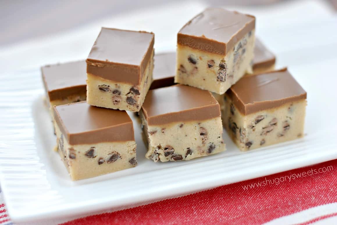 Peanut butter cookie dough with chocolate topping on a white plate.