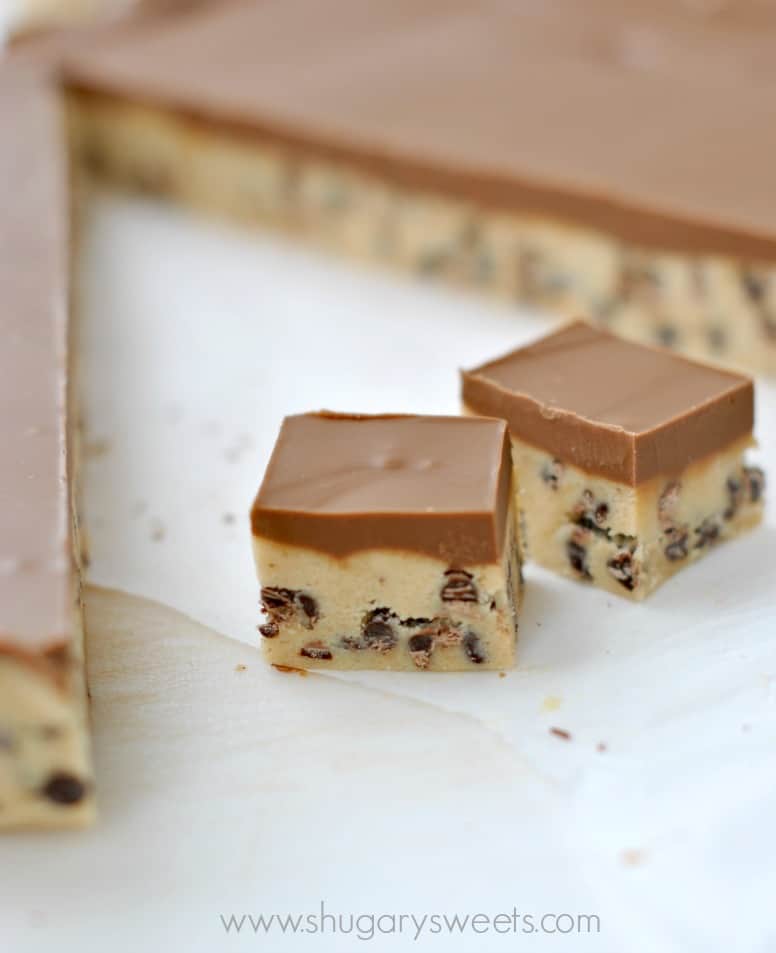 Two pieces of peanut butter cookie dough bars cut into squares.