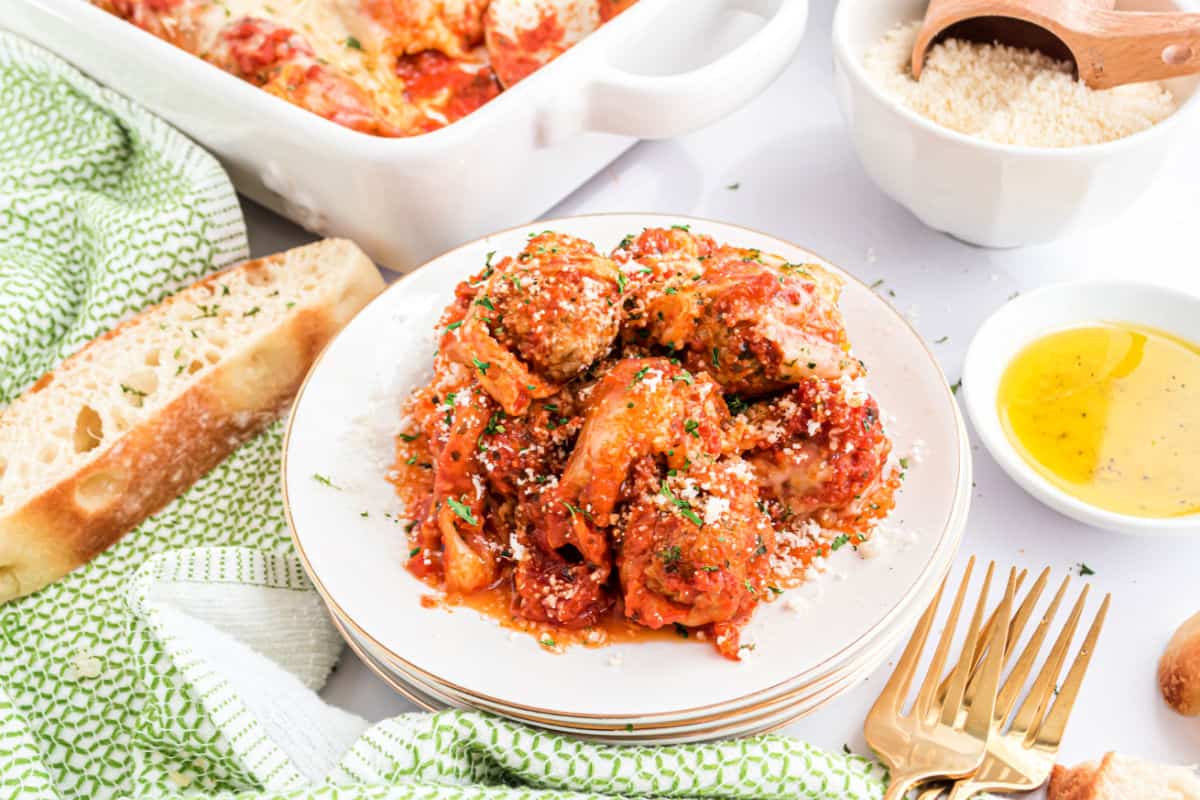 Meatballs and sauce on a white serving plate.