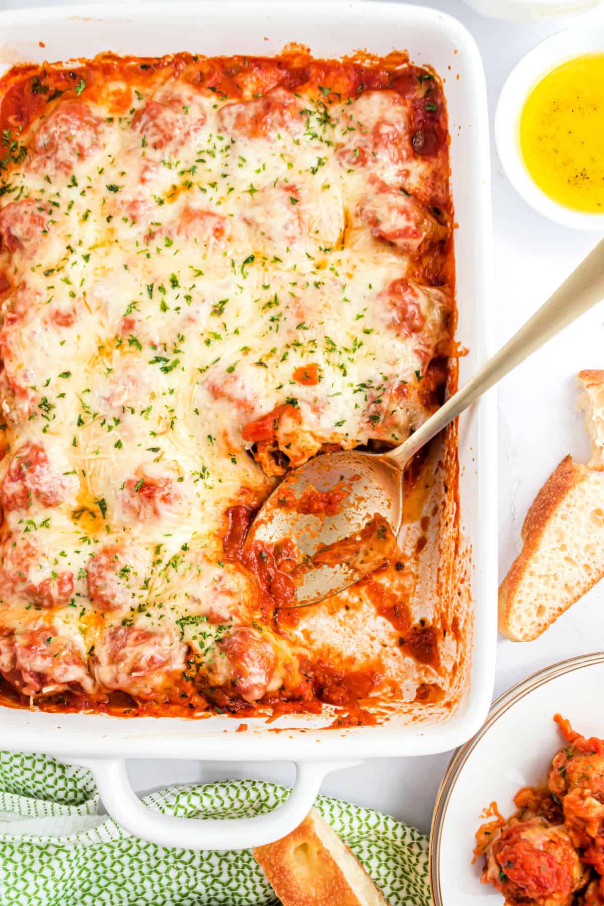 Meatball parmesan casserole in a 13x9 baking dish.