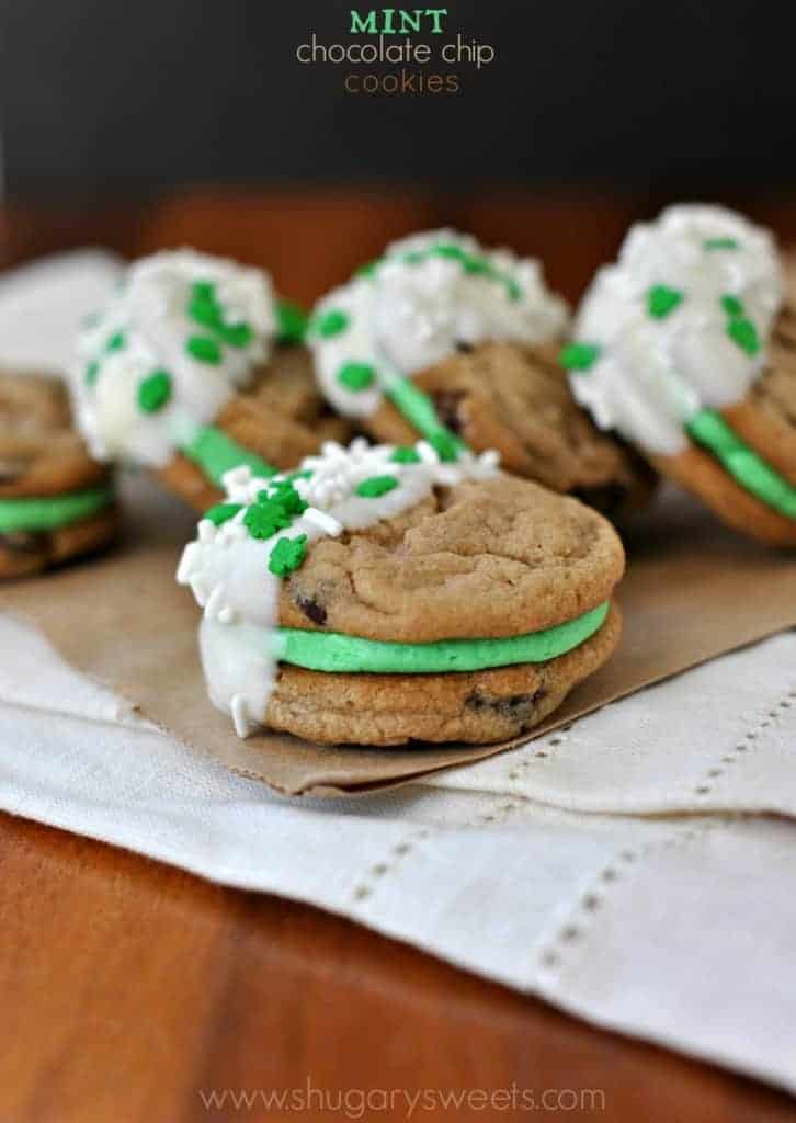 Mint Chocolate Chip Sandwich Cookies with mint buttercream filling and white chocolate sprinkles,