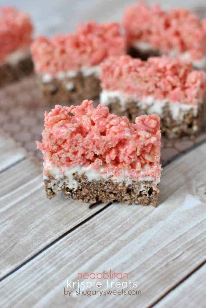 Triple layer Neapolitan Krispie Treats....chocolate and strawberry with a marshmallow frosting center!!