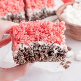 Neapolitan krispie treats cut into a bar.