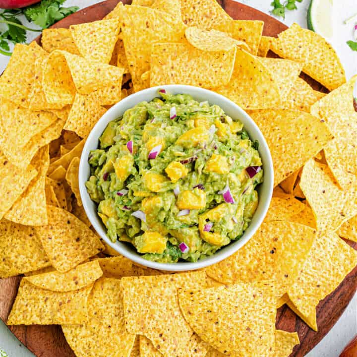 Add diced mangos to your guac for a sweet and zesty twist! Mango Guacamole is a refreshing dip perfect for summer time. Scoop it with chips or add it to your tacos and burritos.