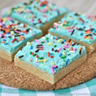 Blue frosted sugar cookie bars cut into squares.