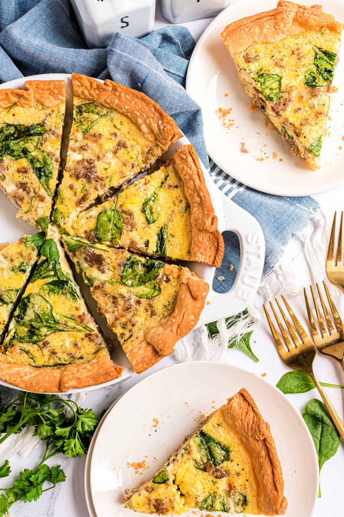 Spinach and sauce quiche cut into slices.