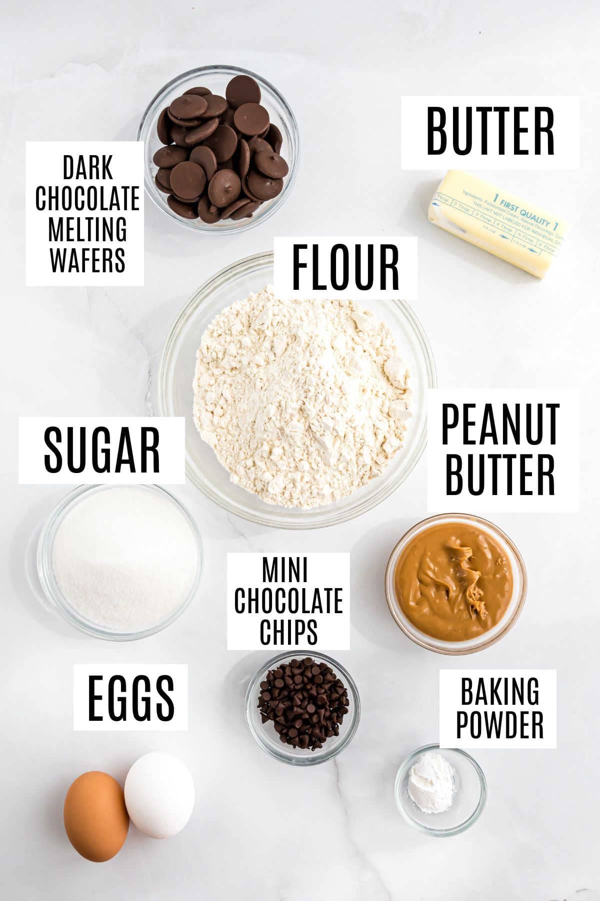 Baking ingredients labeled: flour, sugar, eggs, butter, peanut butter, baking powder, chocolate chips, chocolate wafers—perfect for making chocolate peanut butter biscotti.