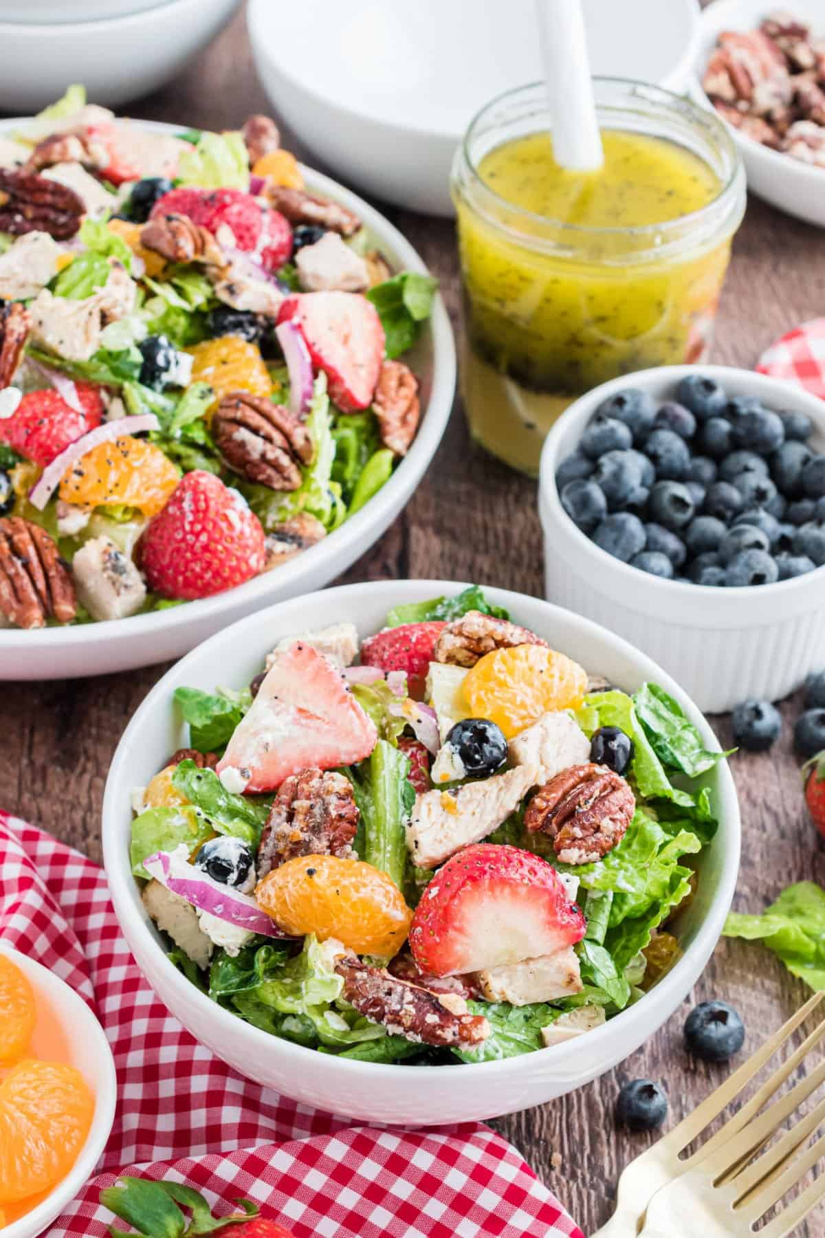 Strawberry spinach salad served in a white bowl.