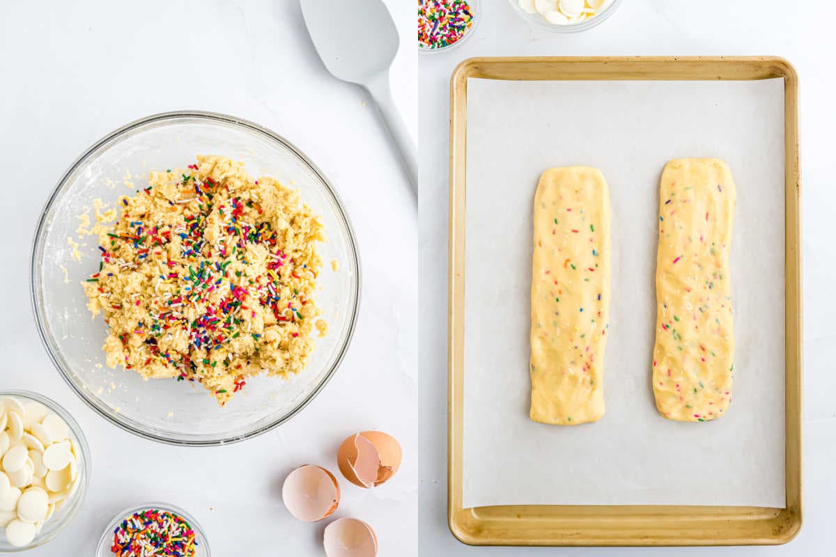 Bowl of sprinkle cookie dough and two birthday cake biscotti dough logs on a baking sheet with parchment paper.