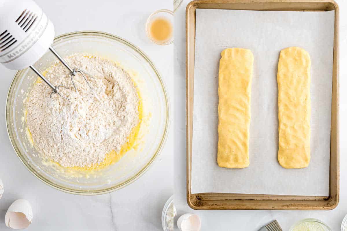 A mixer blends flour in a bowl; next to it, two coconut biscotti dough logs rest on a parchment-lined baking sheet.