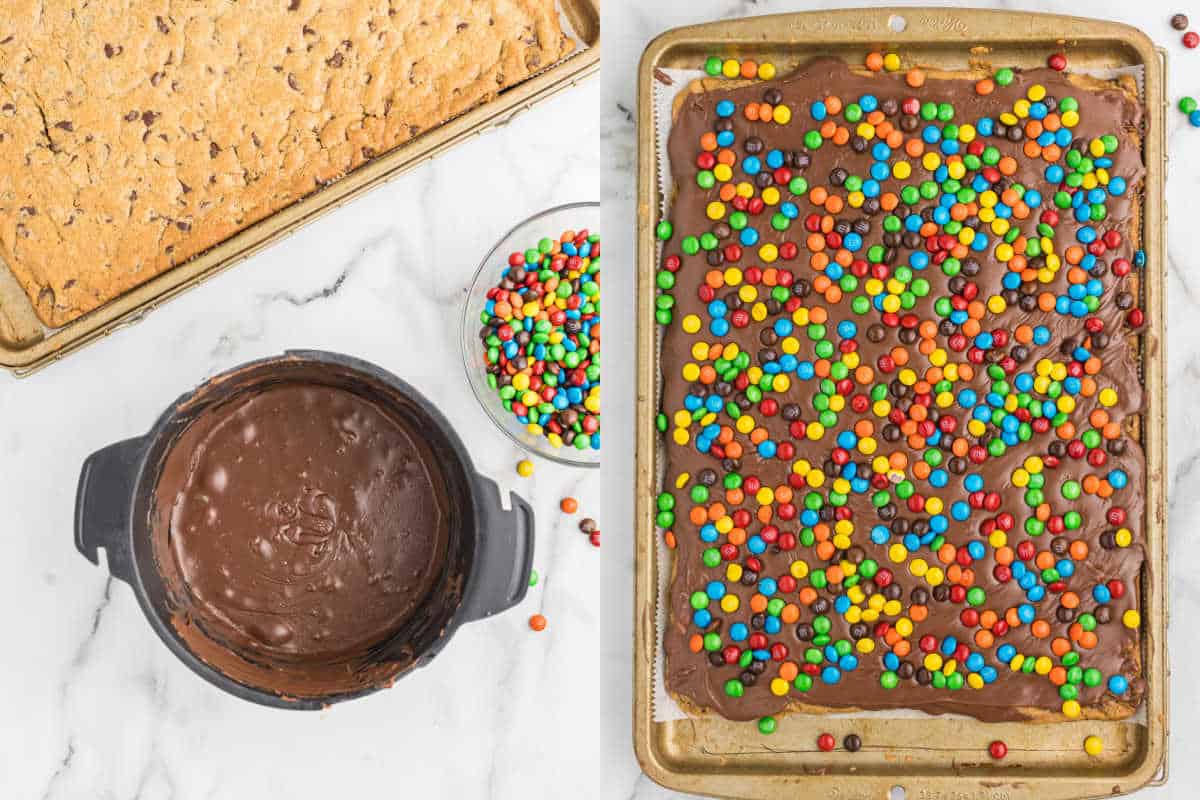 A tray of rainbow fudge cookie bars topped with melted chocolate and colorful candy-coated chocolates on a baking sheet.