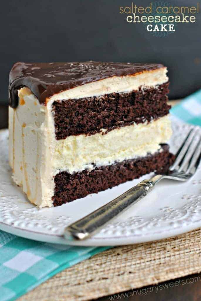 Salted Caramel Cheesecake Cake: delicious chocolate layered cake with a cheesecake center! Frosted with creamy salted caramel buttercream and chocolate ganache!