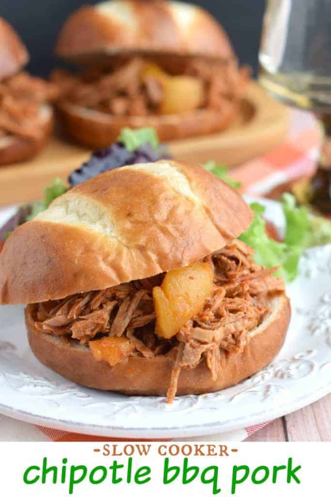 Slow Cooker Chipotle BBQ Pork recipe: delicious tangy pork with sweet peaches on a pretzel bun!