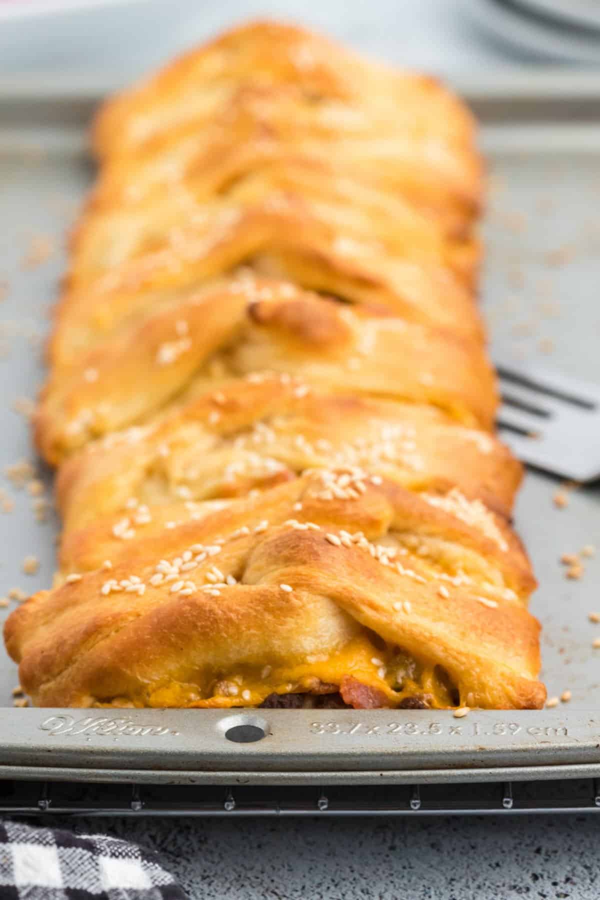 Cheeseburger braid on a cookie sheet.