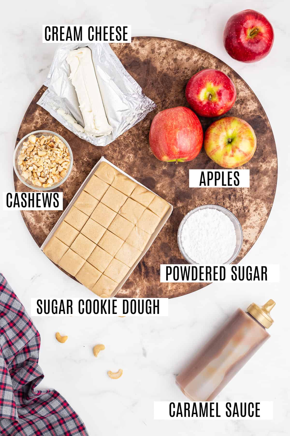 Ingredients needed for caramel apple sugar cookie pizza.