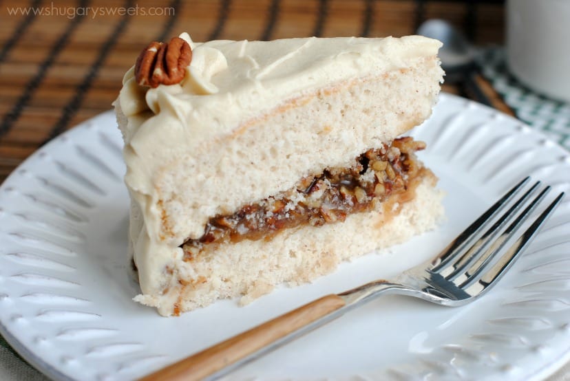 Pecan Pie Cake: double layer spice cake, from scratch, with a pecan pie filling and brown sugar frosting! This is a must have dessert!!!