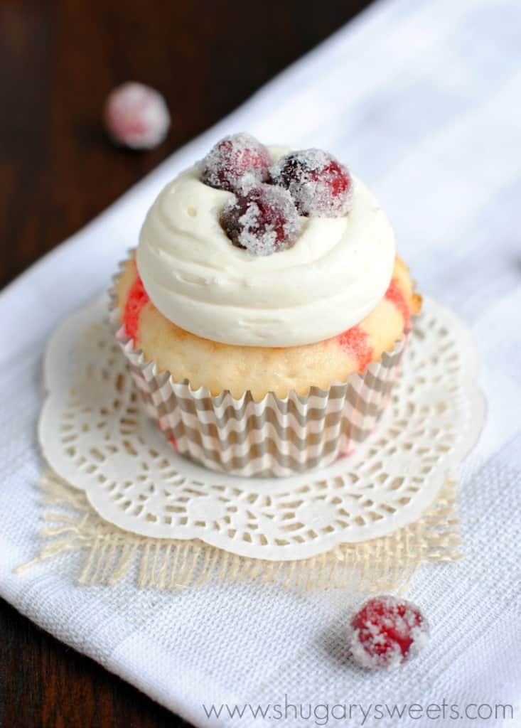 White Chocolate Cranberry Poke Cupcakes with sugared cranberries: this is a must have recipe for the holidays!