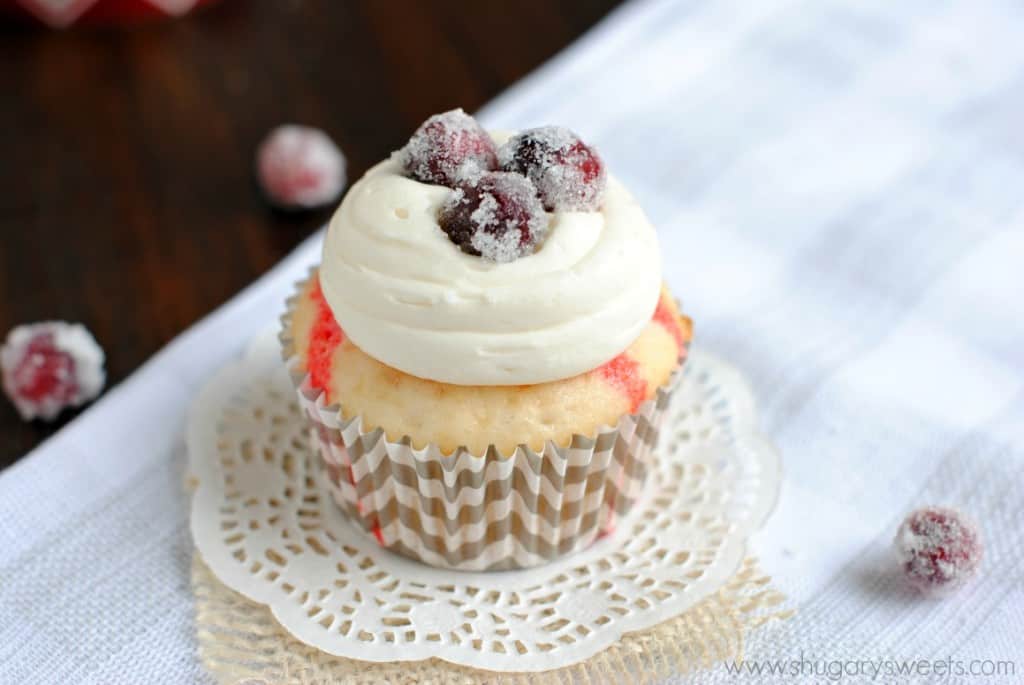 White Chocolate Cranberry Poke Cupcakes with sugared cranberries: this is a must have recipe for the holidays!