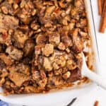 Overnight french toast casserole with pecans in a baking dish.